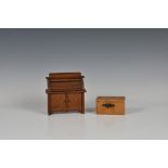 A novelty roll top desk money box, with key, 4¾in. (12.1cm.) wide, together with wooden puzzle box