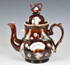 A Victorian barge ware teapot, inscribed "Think of Me", the stoneware body with typical treacle