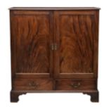 A George III mahogany linen press, the moulded rectangular top over two book matched single panel
