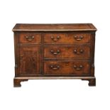 A George III mahogany-cross-banded oak chest of drawers, the rectangular top over a single short