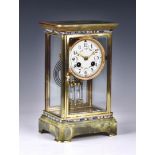 A French four glass onyx and champleve enamel cased mantel clock, early 20th century, the eight