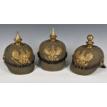 German Military reproduction headgear collection, consisting of three WWI style felt pickelhaube