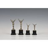 Four Art Deco period swimming trophies, each depicting base metal swimmers poised to dive wearing