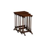 An Edwardian mahogany nest of tables, the crossbanded ebony and boxwood strung tops over slender