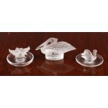 Two Lalique glass pin dishes, one featuring a frosted swan, the other two frosted love birds