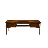 A rosewood desk by Sibast, Denmark, mid 20th Century, the book-matched top over two banks of two