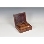A Victorian artist's paint box, mahogany box with a single drawer, with a tolled leather insert to