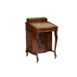 A Victorian carved walnut Davenport, the ¾ galleried hinged top opening to a fitted stationary