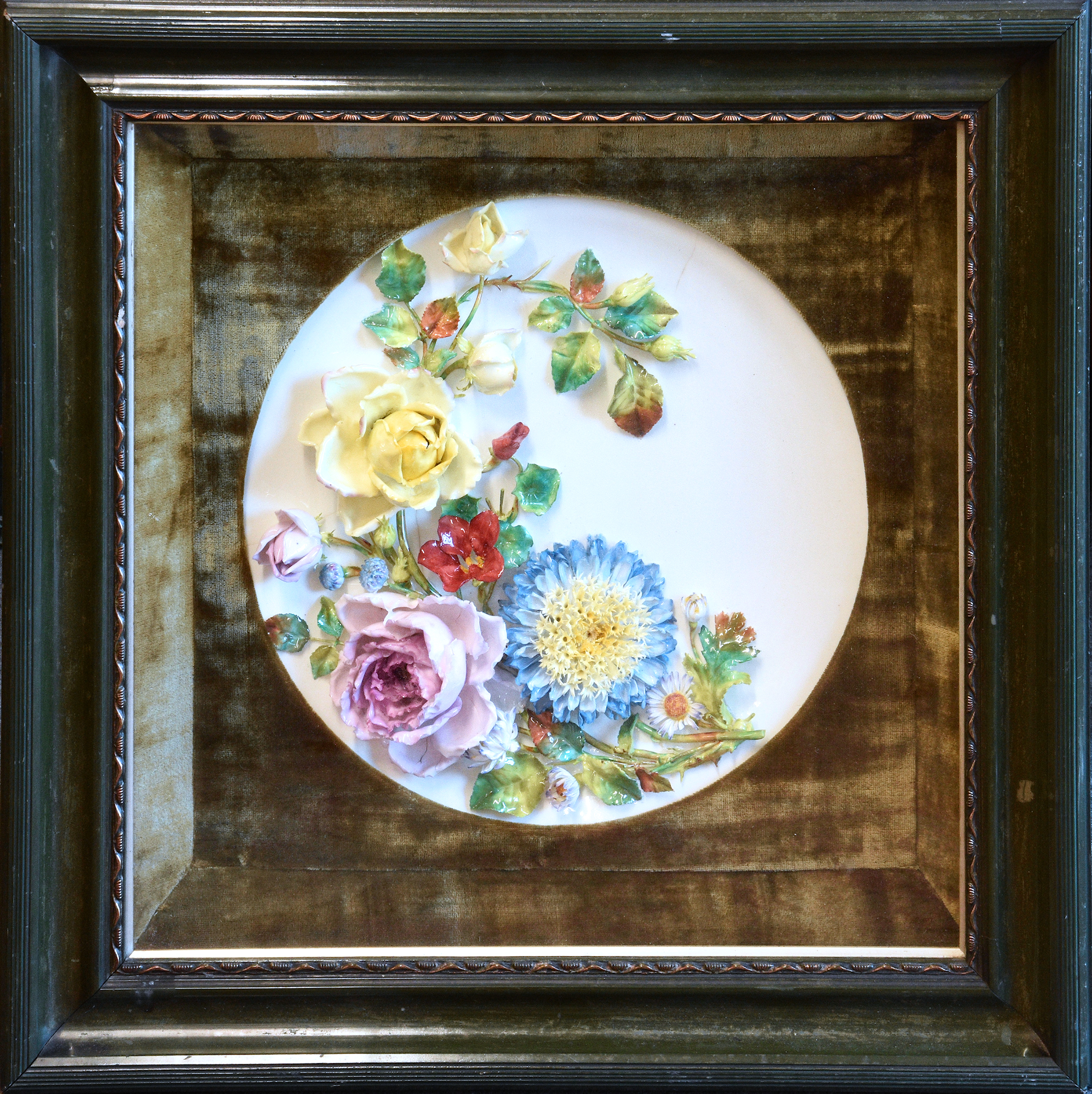 A late Victorian porcelain wall plaque of dished circular form, possibly Moore Brothers, richly - Image 2 of 2