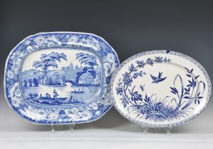 An early 19th century large blue and white pottery meat platter, printed with 'Wild Rose' pattern,
