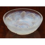 A Lalique opaline glass 'Dauphins' bowl, with multiple species of impressed fish, swimming among