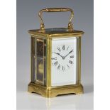 A French gilt brass carriage clock, early 20th century, the twin train movement striking the hours