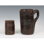 A Nepal (Upper Mustang) carved wood milk jug, probably early 20th century, the stylised handle