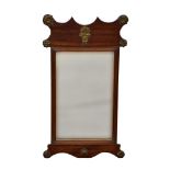 A George II style mahogany fretwork and brass mirror, the rectangular plate with reeded slip and