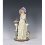 A large Lladro figurine 'Time for Reflection', young lady modelled standing, leaning against