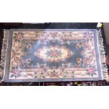 A small Chinese floral rug, in pale blue and ivory, 60 x 45in. (152.5 x 114.25cm.).