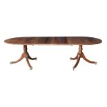 A George III style cross banded mahogany double pedestal dining table, late 20th century, raised