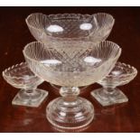 A pair of Georgian cut glass navette pedestal dishes, on knopped stems and raised on round stepped