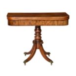 A late Regency D-shaped mahogany tea table, the boxwood strung top over a rosewood edge banded