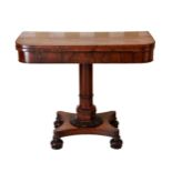A William IV rosewood D-shaped tea table, the swivelling top with storage beneath, on an octagonal