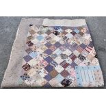 A Victorian and later patchwork quilt, one side having floral and foliate design in greens, reds and