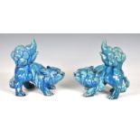 A pair of Chinese turquoise glazed stoneware Fo Dogs, probably early 20th century, 7½in. (19cm.)