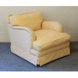 A Howard style low back armchair, late 20th century, 31in. (78.75cm.) wide, 27½in. (70cm.) high.
