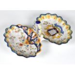 A late 19th century St Malo faience two section crudité dish, with a scalloped edge, painted with