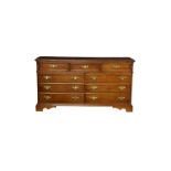 A Bernhardt American style long chest of drawers, the moulded rectangular top over three short