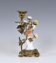A Samson porcelain ormolu-mounted bird candlestick, 19th century, composed of a porcelain bird