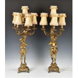 A pair of modern Louis XVI style brass figural table lamp candelabra, each figure holding cornucopia