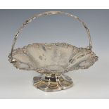 A Victorian silver plated copper fruit basket, with applied fruiting vine border and pierced swing