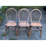 Ercol - Lucian Ercolani - a set of three mid century Utility beech and elm Windsor dining chairs,