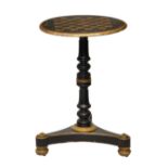 A late-Regency ebonised, parcel gilt and penwork games table, the circular gaming top with