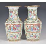 A pair of Chinese Canton famille rose vases, early 19th century, of shouldered, baluster form,