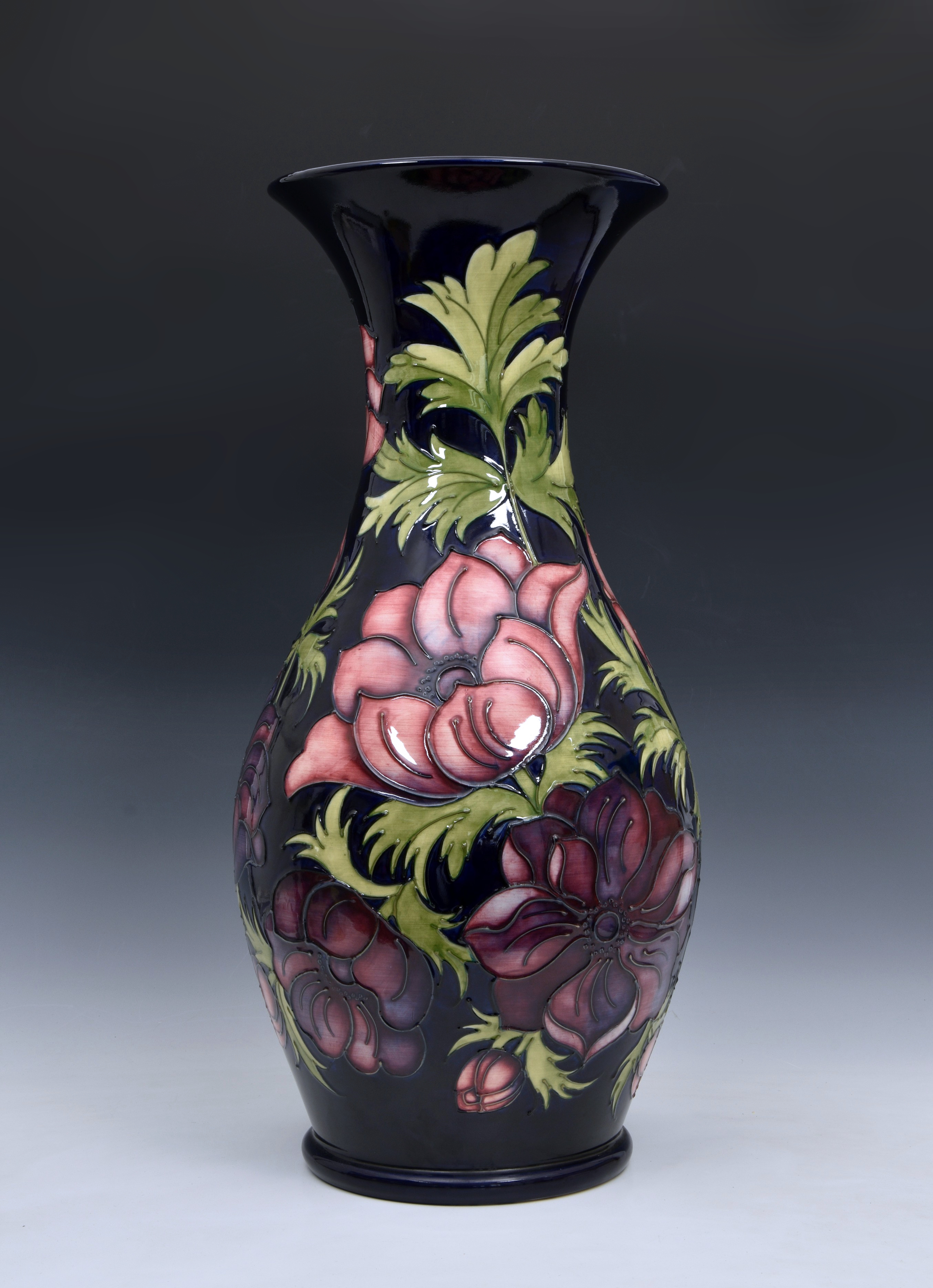 A large Moorcroft Pottery floor standing baluster vase, with flared rim, 'anemone' pattern, on