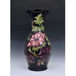 A large Moorcroft Pottery floor standing baluster vase, with flared rim, 'anemone' pattern, on