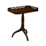 A George IV mahogany tripod silver table, the rectangular top with pierced gallery and scalloped,