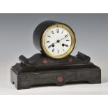 A late 19th century black slate drum clock, the white Roman enamel dial with blued steel hands and