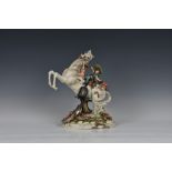 A Capodimonte porcelain group of children on horseback, titled 'Far West', by Tiziano Galli, 14½