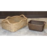 A large woven rattan basket, of rounded, rectangular form, with side and end handles, 33¼ x 24in. (