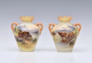 A pair of Royal Worcester porcelain highland cattle painted twin handled vases by Harry Stinton, one