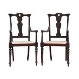 A pair of 19th century Anglo-Indian carved hardwood open armchairs, possibly padouk wood, carved