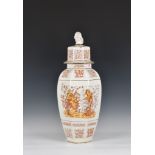 A octagonal floor vase and cover, the central decoration depicting two ladies amidst grapevine,