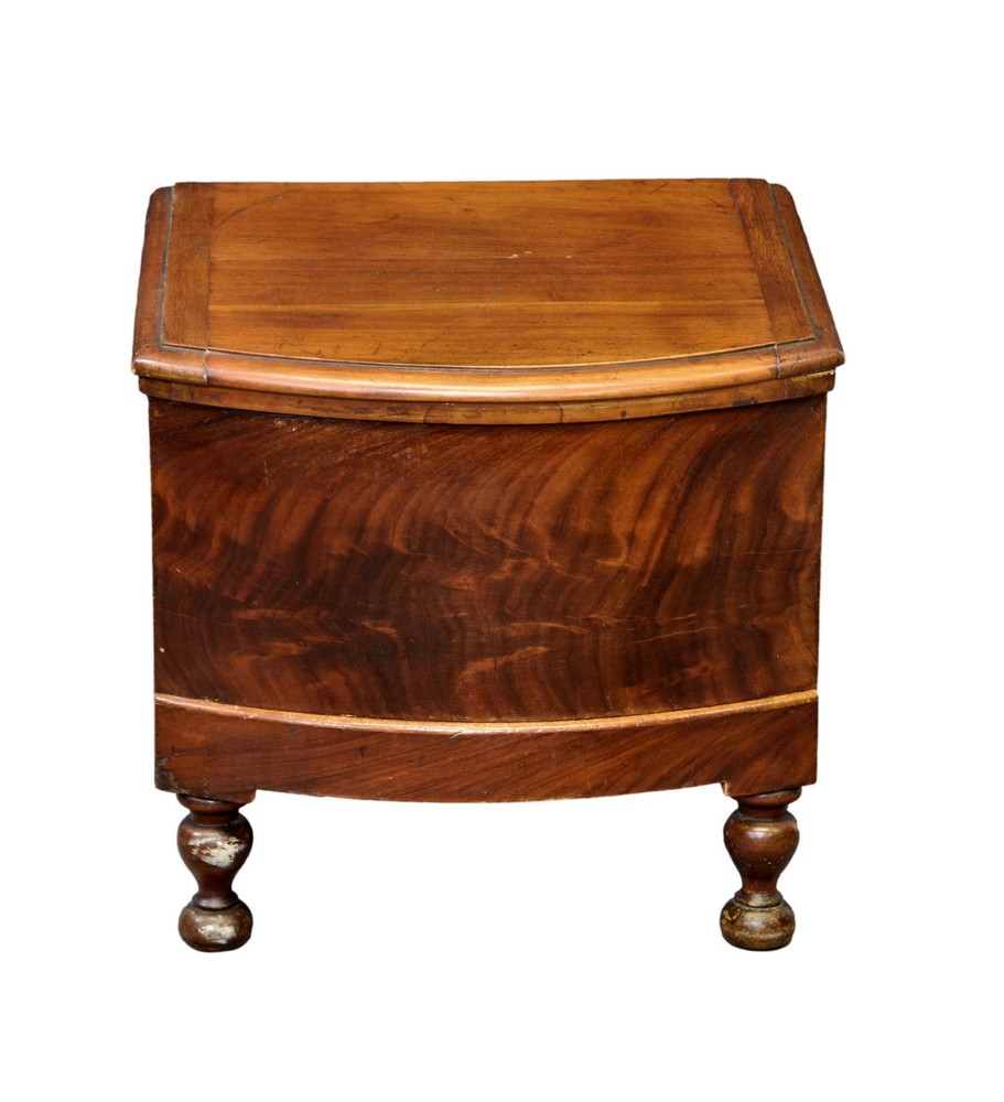 A Victorian mahogany bowfront step commode with china lidded potty and pull-out lower drawer with