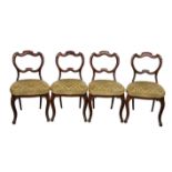 A set of four mid 19th century mahogany cartouche back dining chairs,