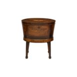 A Regency oval inlaid mahogany and marquetry wine cooler, the oval crossbanded top with central