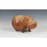 A large wooden model of a comical Hippopotamus, 18in. (46.8cm.) long. * Condition: Some natural