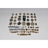 A large collection of Military cap badges and buttons etc, to include Royal Guernsey Light Infantry;