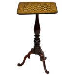 A mid-19th century mahogany, penwork and Japanned tripod games table, the square chess board top